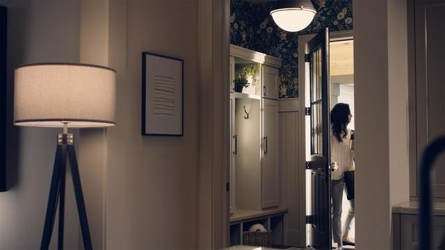 Woman coming indoors